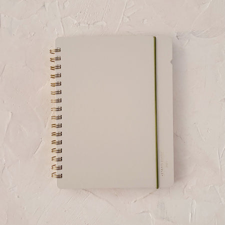 beige cover of planner on textured background