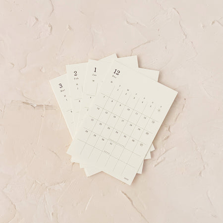 Monthly calendar stickers on textured background
