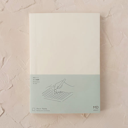 grid notebook on textured background