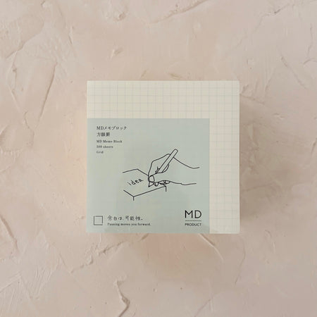 grid memo pad on textured paper