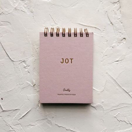 Lilac jotter notebook on textured background