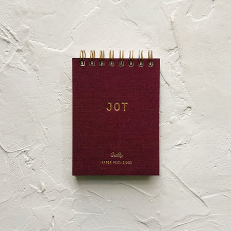 mulberry notebook on textured background