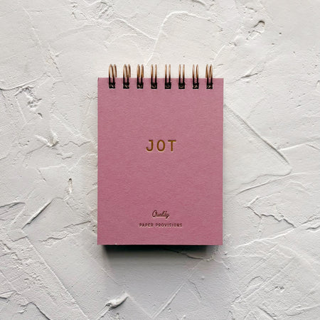 Light purple  jotter notebook on textured background 