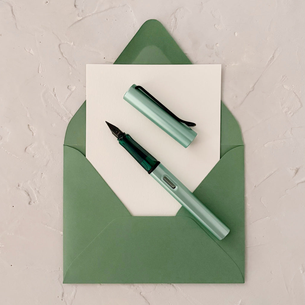 Mint fountain pen on textured background