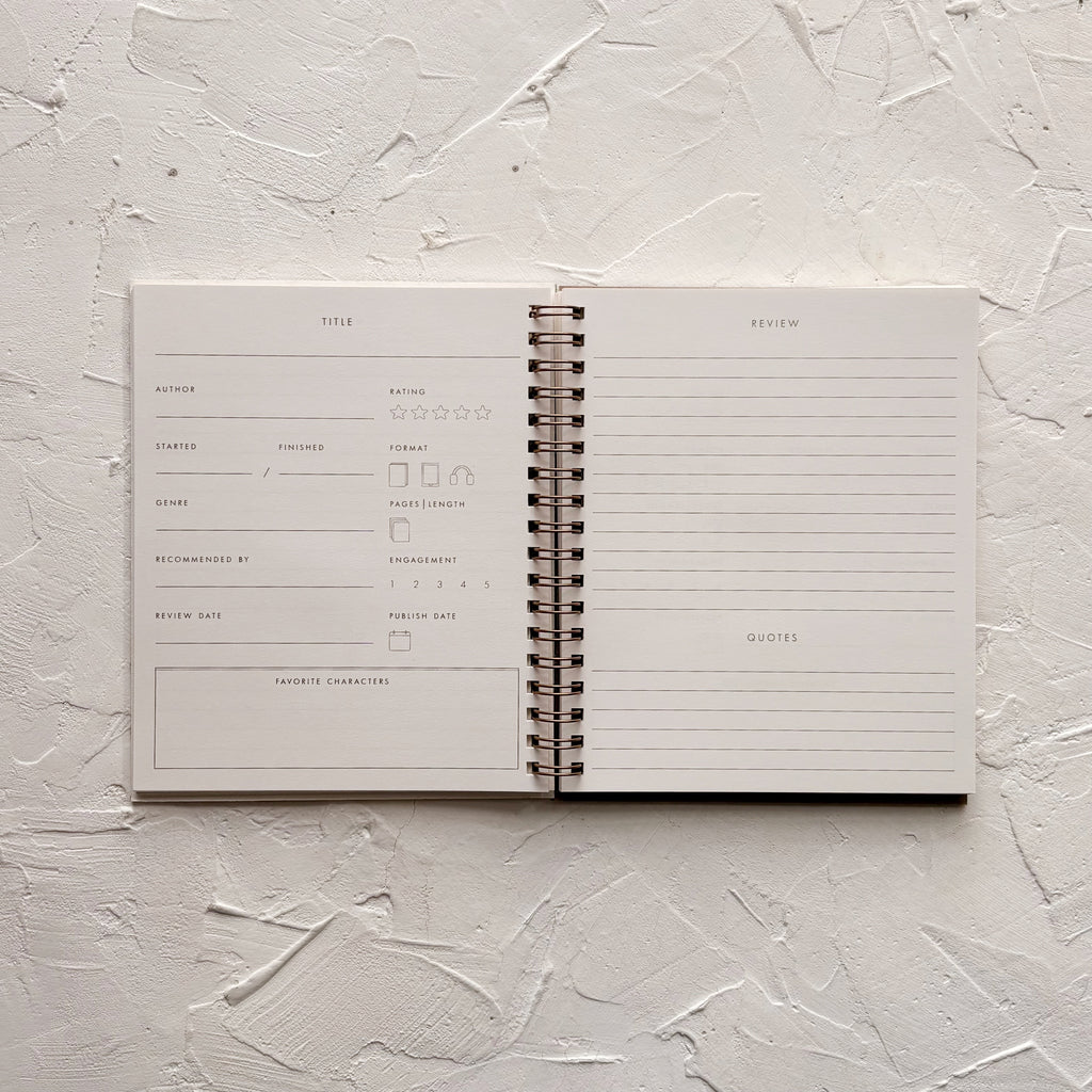 open reading log notebook on textured background