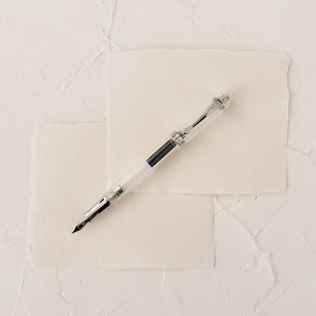 transparent fountain pen on textured paper
