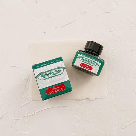 Ink bottle labeled 