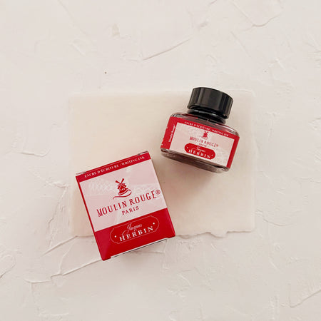 Ink bottle labeled 