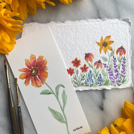 Artistic illustrations of flowers on small cards with sunflowers around