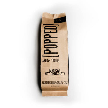 Packaged in a brown and black paper bag. Black text saying, 