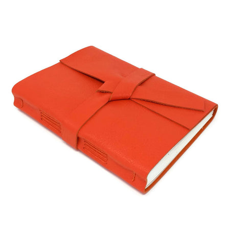 Vibrant Orange soft leather cover with two leather straps crossed in the middle.