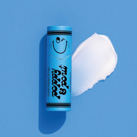 Small blue tube with black text saying, “Poppy & Pout Bloo Razzleoo”. Image of a smiley face on cap on top of tube. Black stripes on top and bottom of tube.