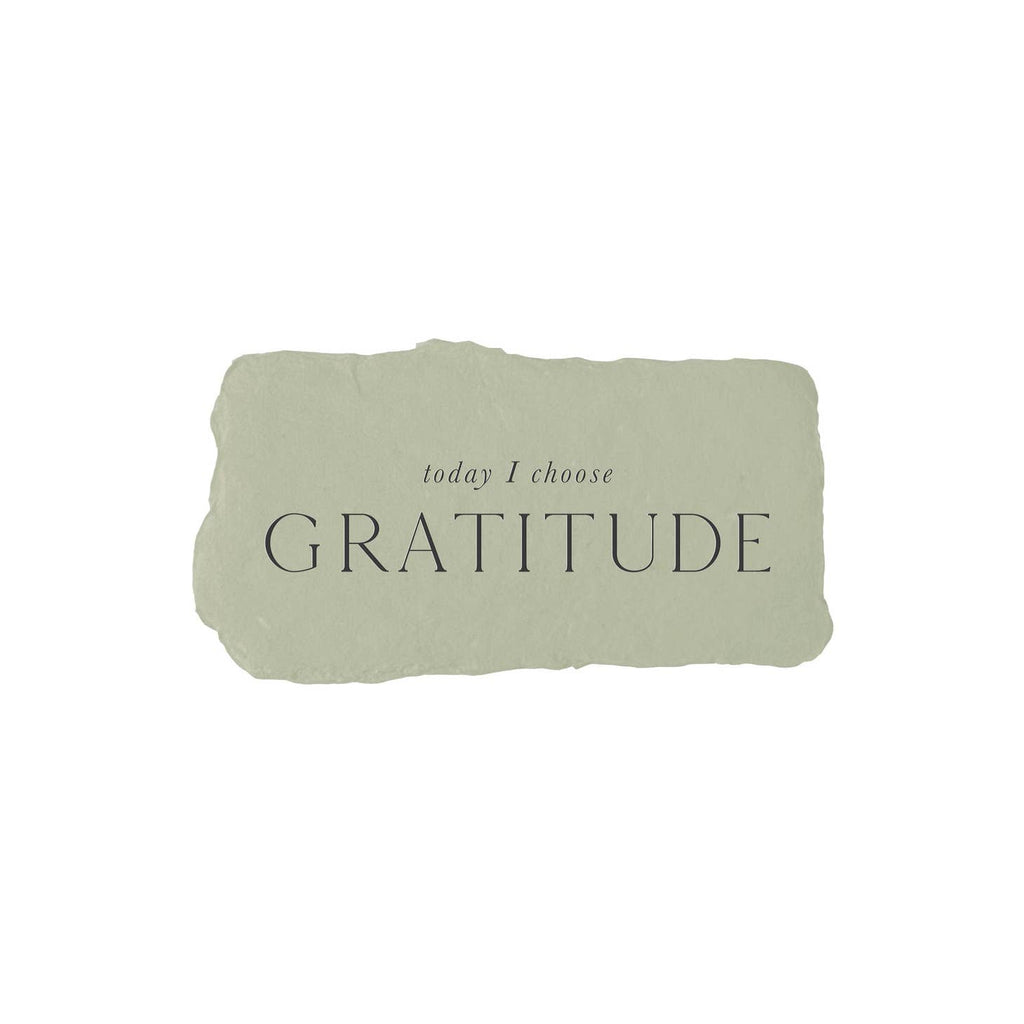 Green rectangle with torn edges and black text saying, “Today I Choose Gratitude”.