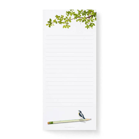 White lined notepad with image of a black bird sitting on a white pencil on bottom of pad and green tree branches in top right corner of pad.
