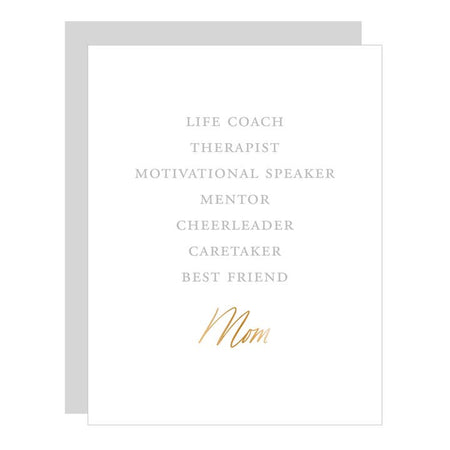 White card with gray and gold text saying, “Life Coach Therapist Motivational Speaker Mentor Cheerleader Caretaker Best Friend Mom”. A gray envelope is included.
