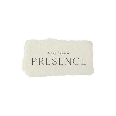 Light gray rectangle with torn edges and black text saying, “Today I Choose Presence”.