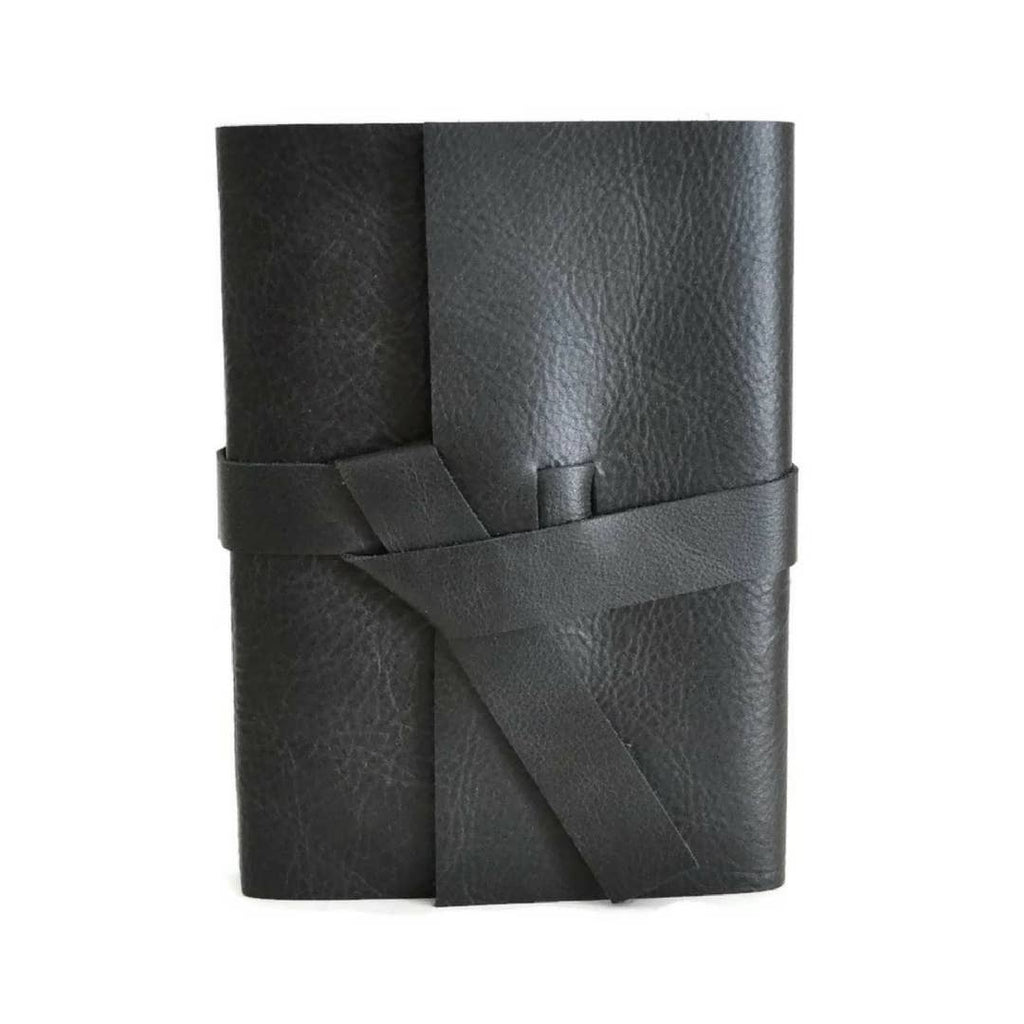 Black soft leather cover with two leather straps crossed in the middle.