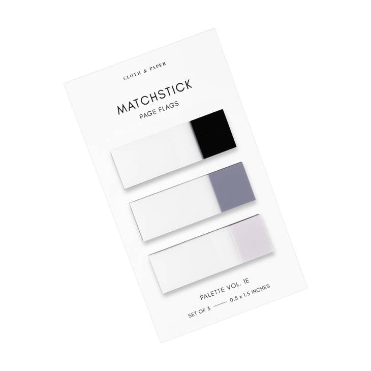 Rectangle sticky notes in black, gray and light pink shades presented on a ivory background.