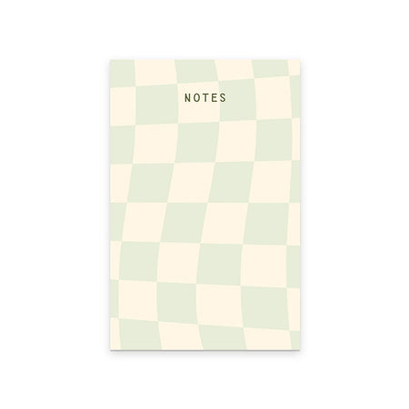 Cover with checkerboard design in ivory and seaglass green squares. Black text saying, “NOTES” in top center.