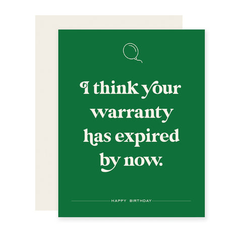 Green background with white text saying, ”I think your warranty has expired by now”. Image of a white balloon in top center. A cream colored envelope is included.
