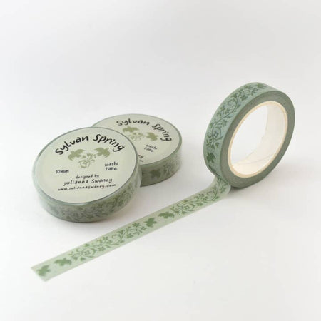 Green washi tape with repeating images of green flowers and green birds.