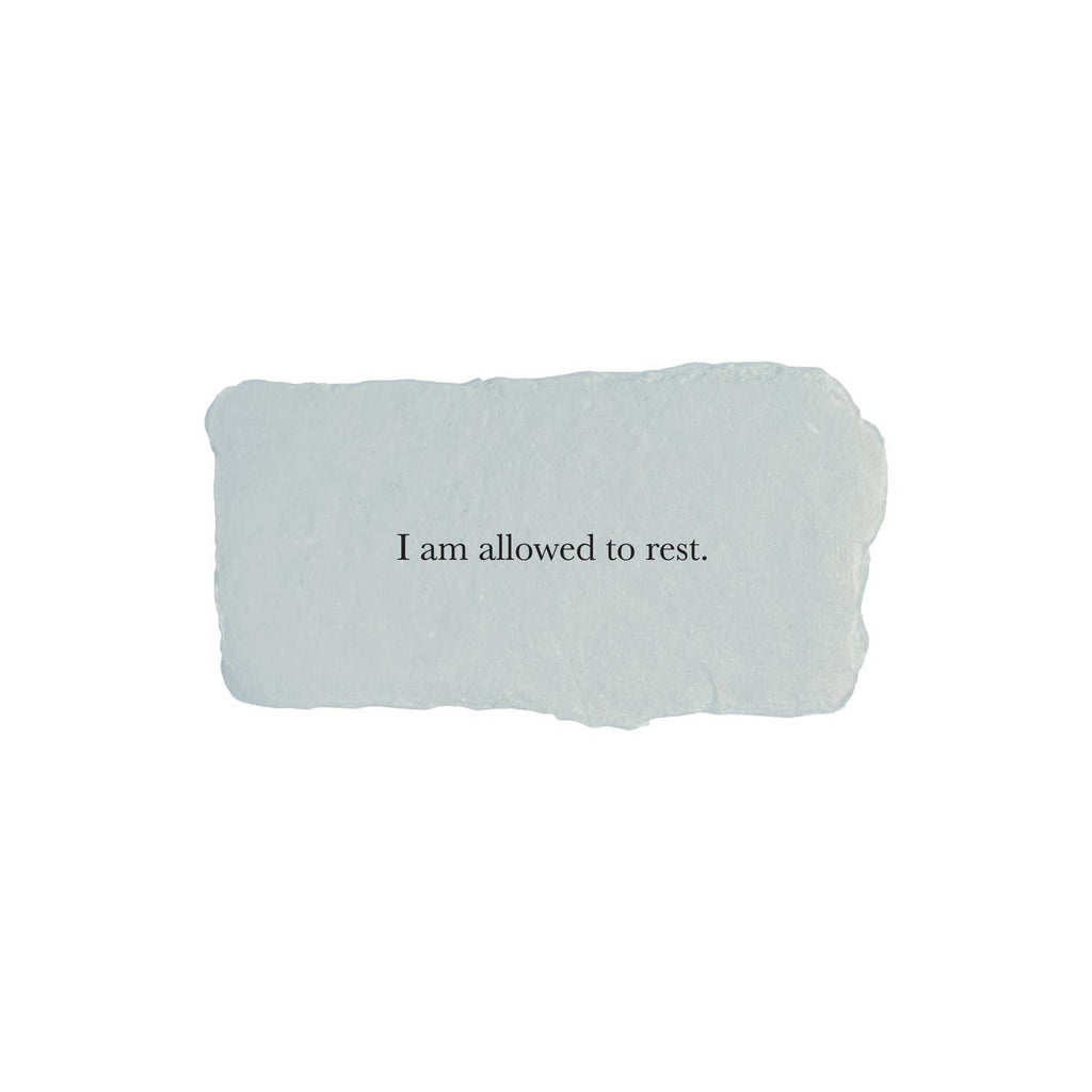 Gray rectangle with torn edges and black text saying, “I am Allowed to Rest”.