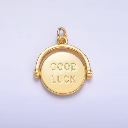 Gold charm in the image of a circle with text saying, “Good Luck” in the center.