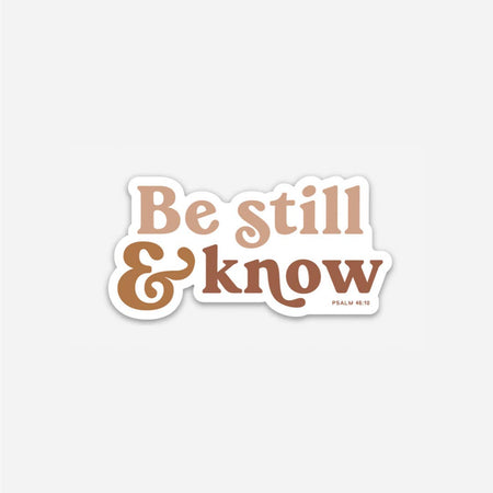 White sticker with brown and orange text saying, 