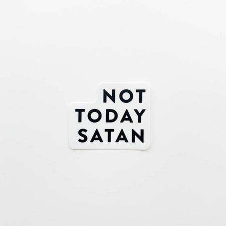White sticker with black text saying, “Not Today Satan”.