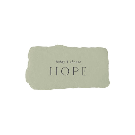 Gray rectangle with torn edges and black text saying, “Today I Choose Hope”.