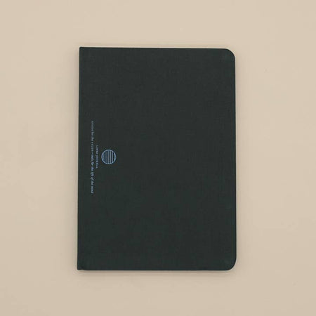 Green linen cover with blue foil circle logo and text saying, “Linen Journal”.