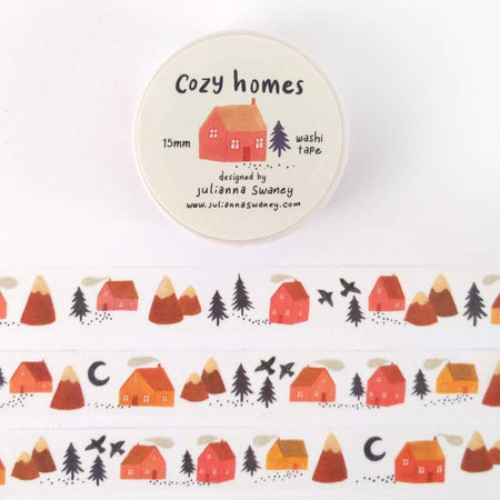 White washi tape with repeating images of different houses, green pine trees, mountains, and birds.