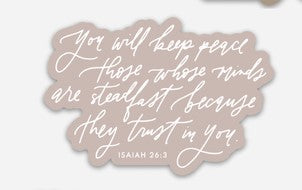 Light pink sticker with white script text saying, “You will keep peace those whose minds are steadfast because they trust in You. Isaiah 26:3”.