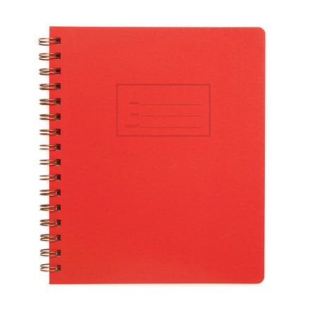 Warm red background with rectangular box in center with a place to write name, date and subject. Metal coil binding on left side.   Inside has line pages.