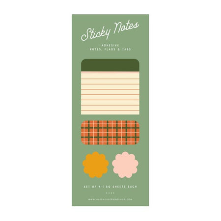 Packaging of sticky notes with different designs on a green background. Designs include lined stripes and an orange and green plaid.