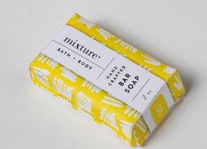 Lavender lemongrassl scented bath soap packaged in a yellow and white floral designed package.
