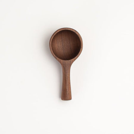 Large wooden shallow scoop spoon.