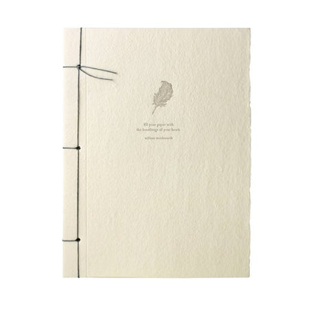 Off white notebook with torn edge cover and gray ribbon binding on left side. Image of a pen quill and gray text saying, “Fill your paper with the breathings of your heart - William Wordsworth”.