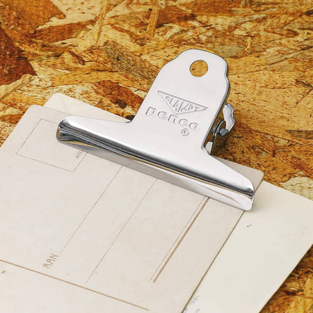 Silver metal claw clip with text “Penco” embossed in center.