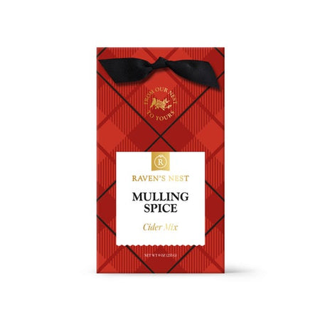 Red and black plaid packaging with a black bow in top center. White box in center with gold and black text saying, “Mulling Spice Cider Mix”. 