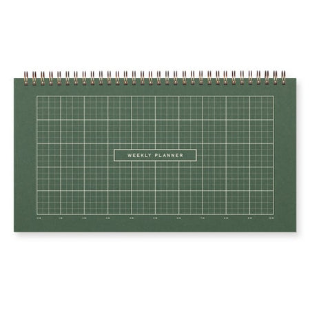 Green weekly planner with grid layout on a white background. Gold coil binding across top.