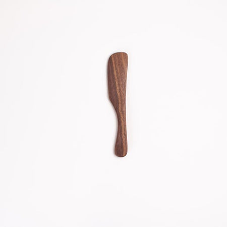 Small wooden spreading knife utensil.