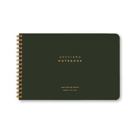 Dark green notebook with gold spiral binding.