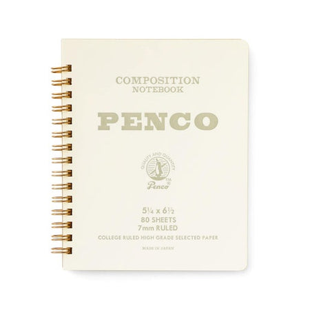 White notebook with gray text saying, “Composition Notebook PENCO”. Gold coil binding on left side of notebook.