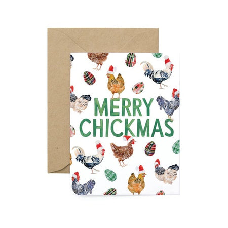 White card with images of several chickens wearing Santa hats with green text saying, “Merry Chickmas”. A brown kraft envelope is included.