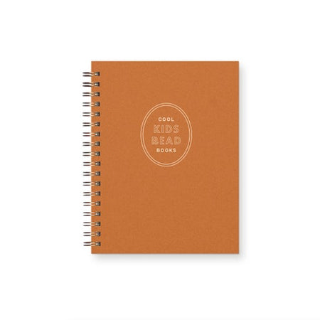 Brown notebook with 'Cool Kids Read Books' text in center on a white background inside of an oval shape. Gold col binding on left side.