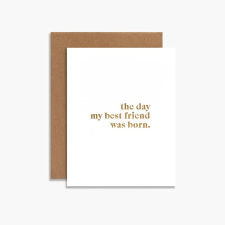 White card with gold foil text saying, “The day my best friend was born”. A brown kraft envelope is included.