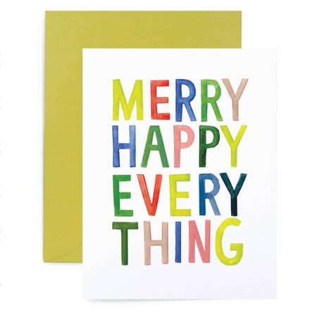 White card with rainbow text saying, “Merry Happy Everything”. A lime green envelope is included.