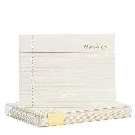 White notecards in the image of lined notebook paper with gold foil text in top right corner saying, “Thank You”. Matching envelopes included.