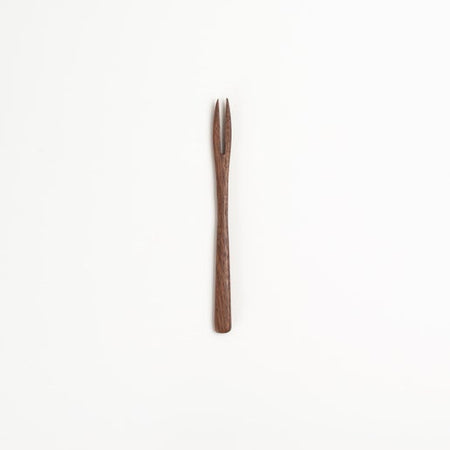 Small wooden olive pick utensil.